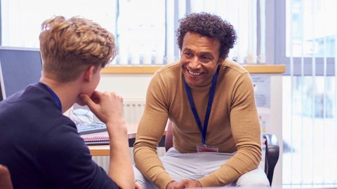 Two people talking in an office