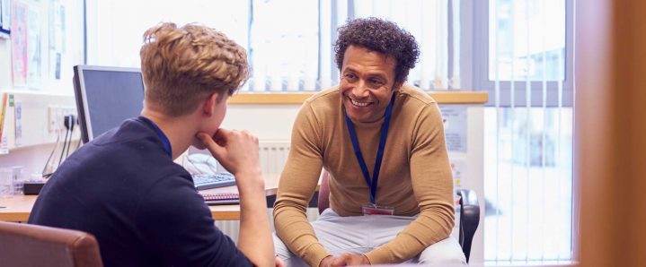 Two people talking in an office
